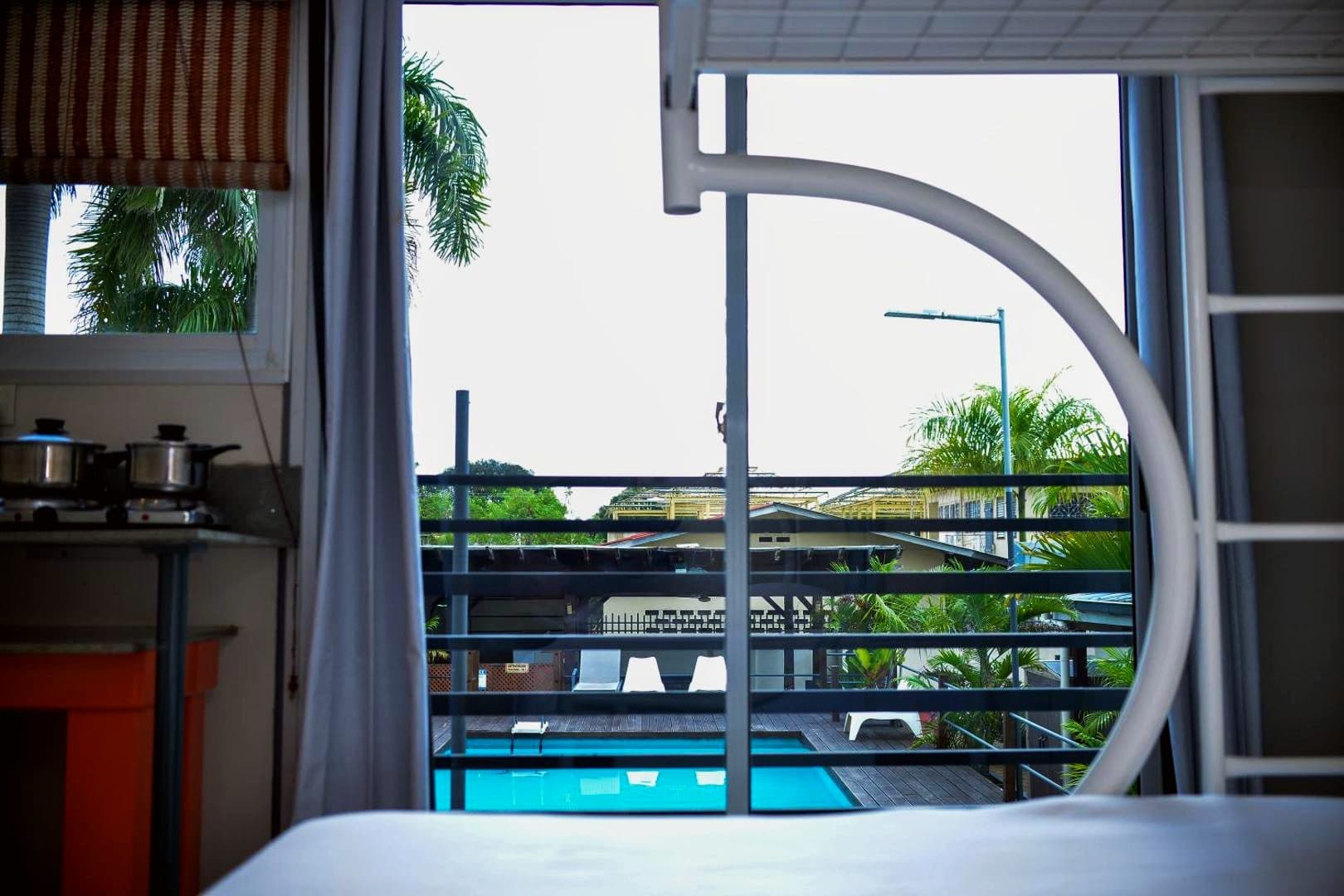 Apartment interior at Elementz Apartments looking out towards the pool