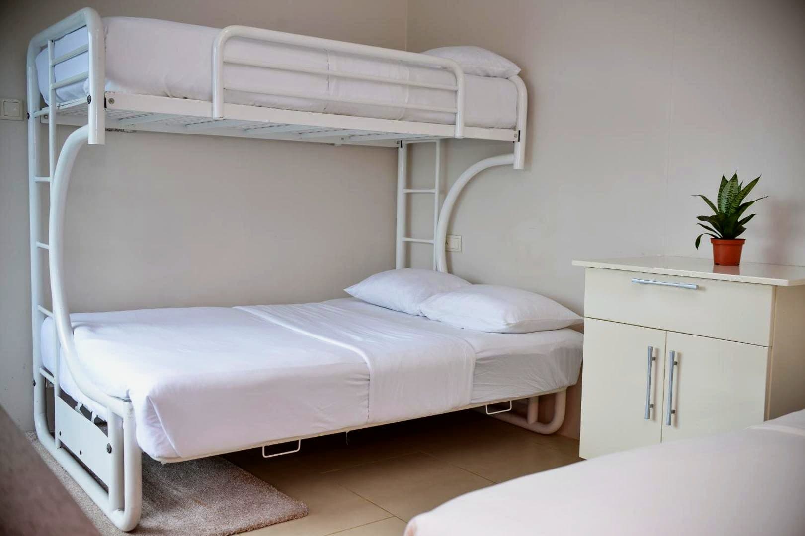 Ground floor room at Elementz Apartments with a bunk bed