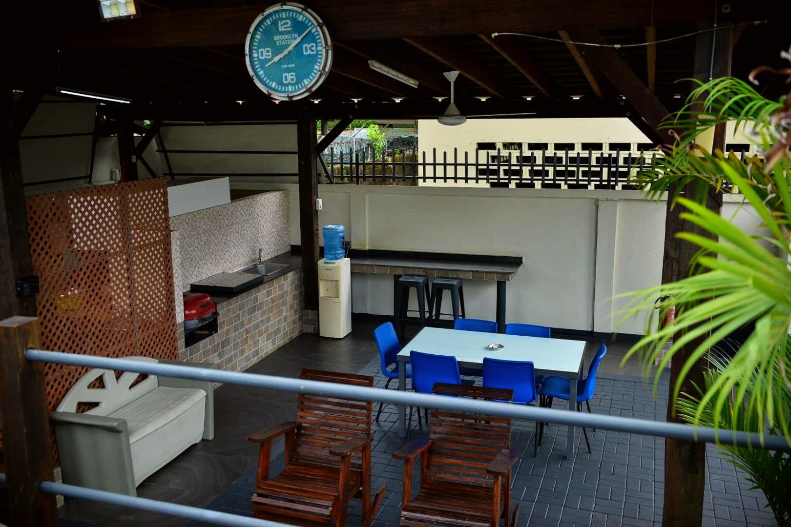 Shared dining area under the pergola at Elementz Apartments