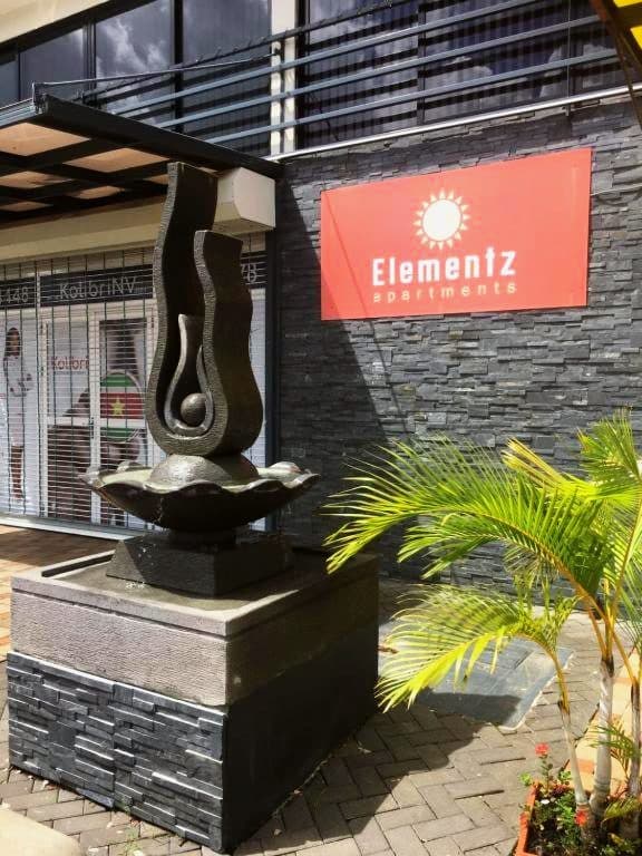Bronze sculpture at the entrance of Elementz Apartments