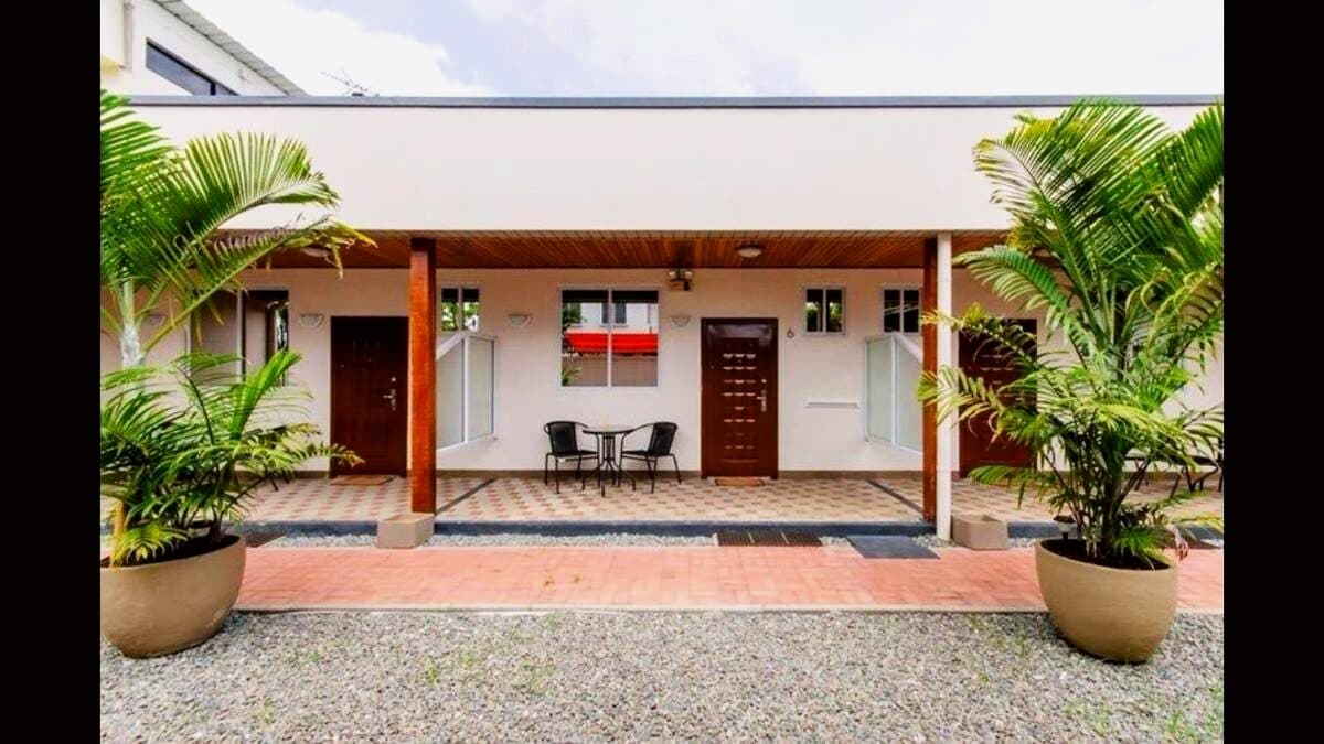 Apartment doors along the planted walkway